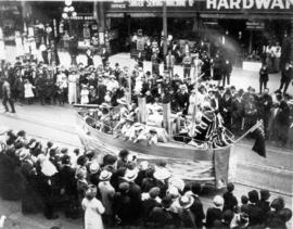 [An unidentified float in the 600 Block of Granville Street during a Victoria Day parade]