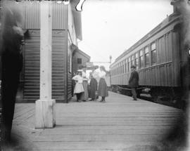 [Woman and girls assembled on platform of C.P.R. station]