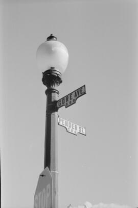 [Stop sign and street light at Gore Ave and Pender Street, 1 of 2]