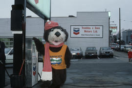 Tillicum beside gas pump at Chevron station on 4th Avenue and Macdonald Street