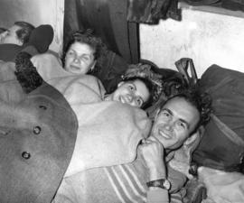 [Hungarian refugees bed down in the Immigration Building at the airport]