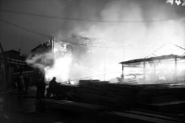 [Firemen fighting fire at Sterling Lumber Co., Powell Street
