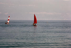 Two sailboats in Burrard Inlet with West Vancouver in background