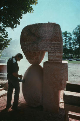 David Marshall at work on sculpture nearing completion