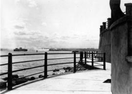 [View of a steamship from a seawall]