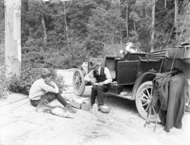 [Cowdell and kids having picnic at side of road during fishing trip]