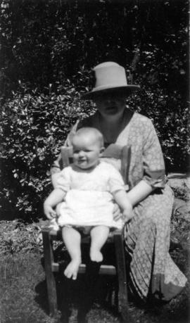 [Octavia Beaton sitting outdoors with Mary Louise Taylor]