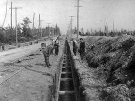 [Looking east from Elm Street along Wilson Road (41st Avenue) at sewer construction]