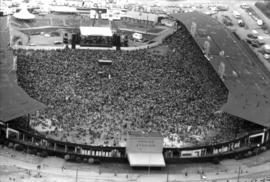 Aerial view of crowd at outdoor concert in Empire Stadium