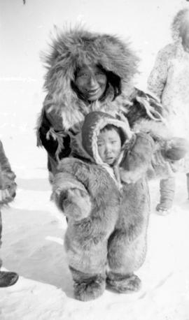[Eskimo grandmother and child wearing fur clothing]