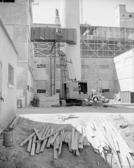 Lifting No. 2 boiler breeching in place; fuel oil tank footings in foreground