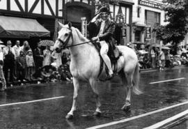 Man dressed as Captain J. Cook on horseback