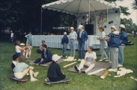 Group assembled beside Chevron Stage