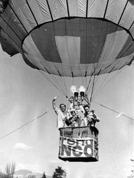 Mayor Tom Campbell, Daffodil Queen Lynn McCulloch, and Stan Sheldrake in a balloon over Stanley Park