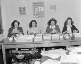 [B.C. Tuberculosis Society volunteers stuffing envelopes for a  mailing campaign]