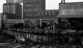 Yard with barrels - Royal Standard Flour in background