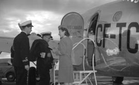 [Vice Admiral Percy W. Nelles being admitted to Trans Canada airlines plane by a stewardess]