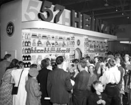 Crowd around Heinz 57 display of condiments