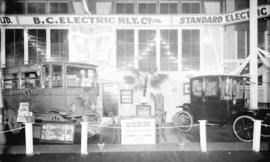 [Display of B.C. Electric Railway Company's electric vehicles, including an electric car and an e...