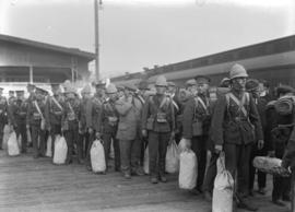 [Military - men with kit waiting to board train]