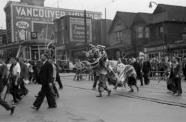 [Lion Dance in Chinese parade crossing the 400 Block East Hastings Street during VJ Day celebrati...