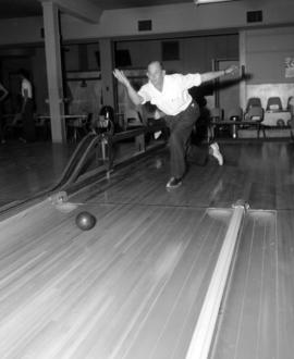 [Bowler in action]