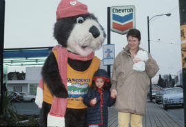 Tillicum poses with woman and child at Chevron station on 4th Avenue and Macdonald Street