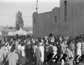 Crowd watching brass band on P.N.E. grounds