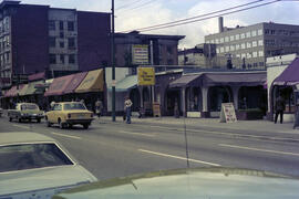 [1000 block Robson Street businesses - Signs for The Old Cheese Shoppe and June Curtis, 1 of 2]