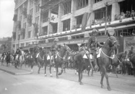 N.W.M.P. [North West Mounted Police] on parade in front of Hudson's Bay Co.
