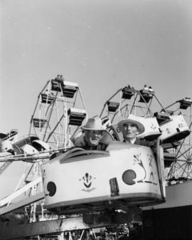 Two senior citizen men on midway ride