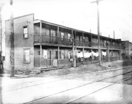 [Apartment building at corner of Fir Street and 3rd Ave W]