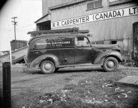 [Industrial Electricians truck parked outside the W.R. Carpenter (Canada) Ltd. Warehouse]