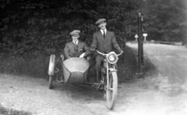 [James Crookall in the sidecar of a motorcycle]