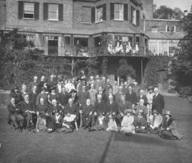 [Group portrait of Agent General F.C. Wade and other Canadians at a garden party]