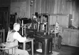 [Man testing wood samples in forestry testing lab at U.B.C.]