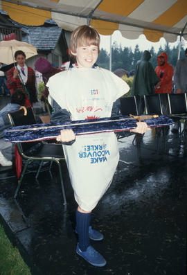 Child holding sword at the Centennial Commission's Canada Day celebration