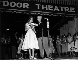 Glenda Sjoberg, winner of Miss P.N.E. 1955, receiving envelope from P.N.E. President J.S.C. Moffi...
