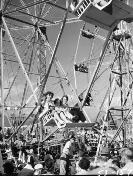 People riding Ferris wheel in P.N.E. Gayway