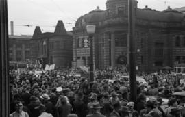 [Crowds at the corner of Main Street and Hastings Street during VJ Day celebrations]
