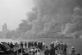[View of Pier "D" engulfed in smoke and flames]