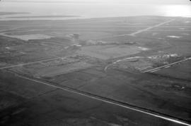 Aerial view of airport terminal, runways and approaches to Sea Island