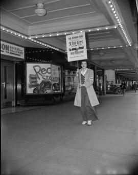 [Orpheum Theatre employee picketing outside the Strand Theatre as part of a movie promotion]