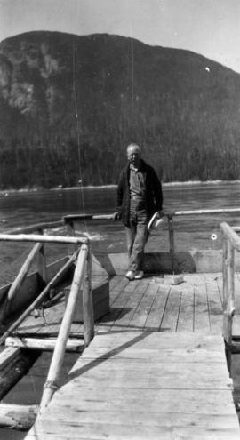 [L.D. Taylor standing on a dock, Stuart Island, B.C.]