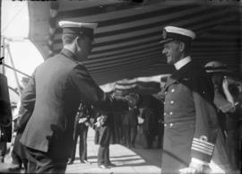 Officers shaking hands on H.M.S. "New Zealand"