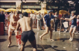 "Giant Fire Drill" participants pass buckets of water