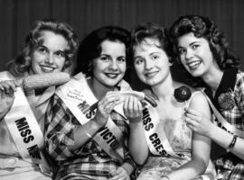 Four Miss P.N.E. 1960 contestants posing with food