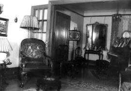 Interior of 1796 West 15th Avenue, far end of living room separated by glass doors