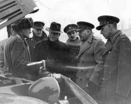 [Major General J.P. Mackenzie and others inspecting machinery]