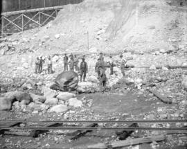 [Men clearing rocks from Coquitlam Dam construction site]